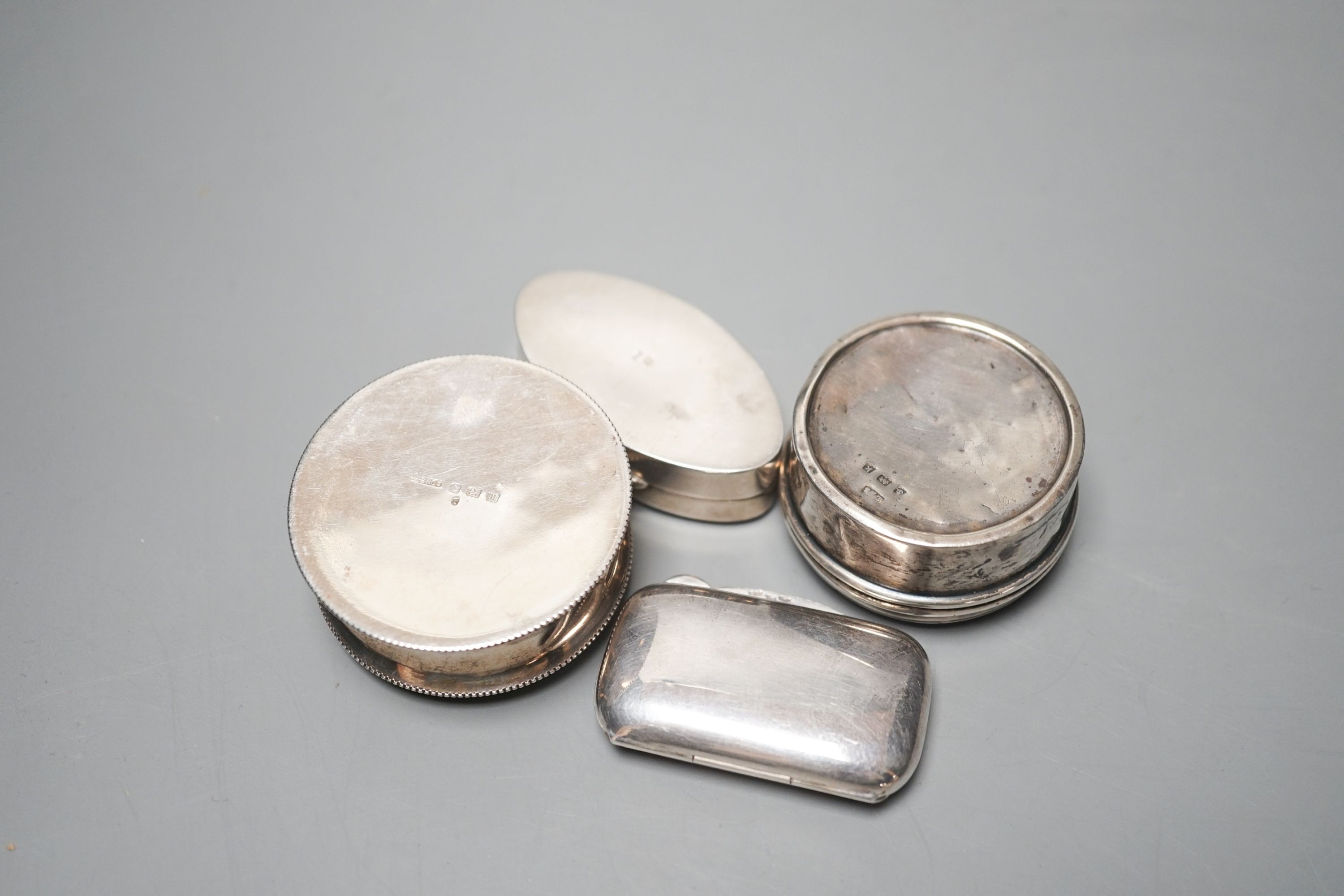 Three assorted early 20th century silver and enamel pill boxes, largest 49mm and a later similar Italian 925 box.